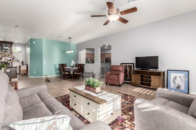 tiled living room featuring ceiling fan