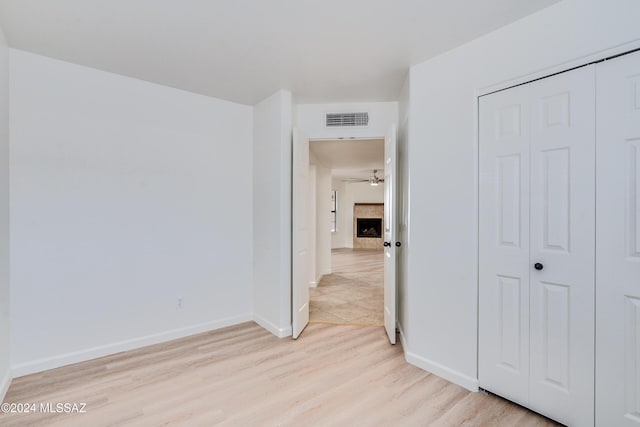 corridor with light wood-type flooring