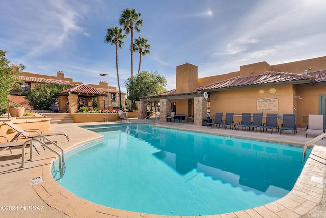 view of pool featuring a gazebo and a patio