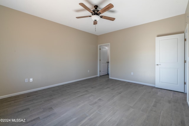 unfurnished bedroom featuring ceiling fan and light hardwood / wood-style floors