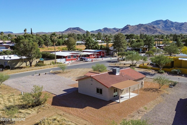 birds eye view of property with a mountain view