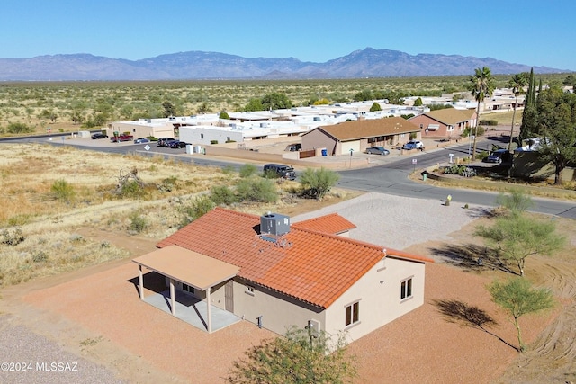 birds eye view of property with a mountain view