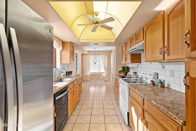 kitchen featuring dishwasher, decorative light fixtures, white electric range oven, stainless steel refrigerator, and sink