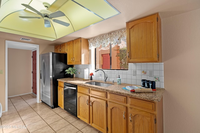 kitchen featuring dishwasher, decorative backsplash, light tile patterned flooring, ceiling fan, and sink