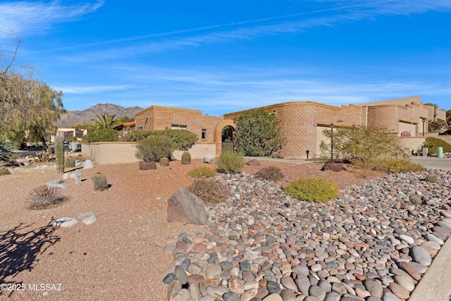 adobe home with a mountain view