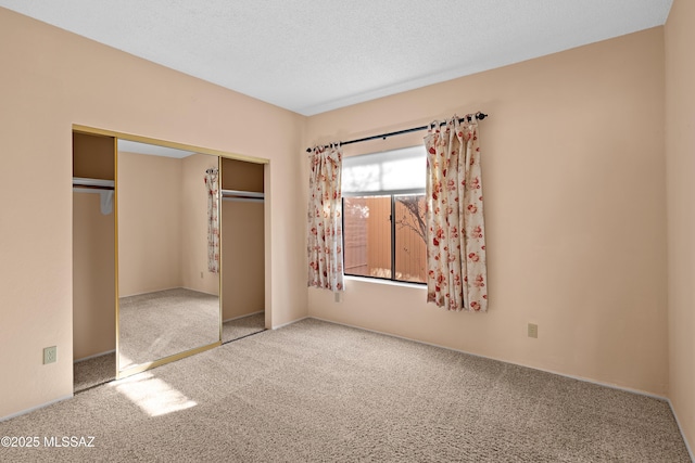 unfurnished bedroom featuring a closet and carpet