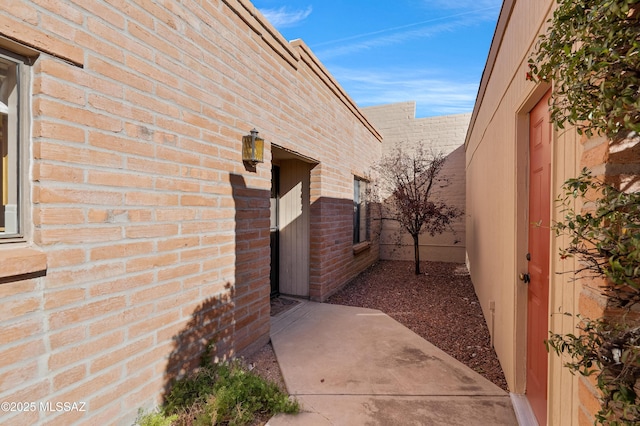 view of side of home featuring a patio