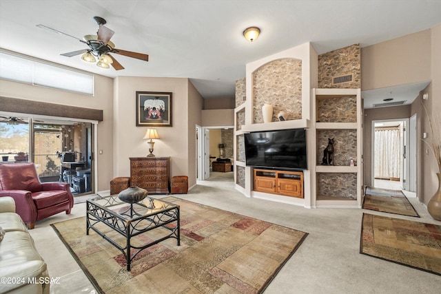 carpeted living room featuring ceiling fan