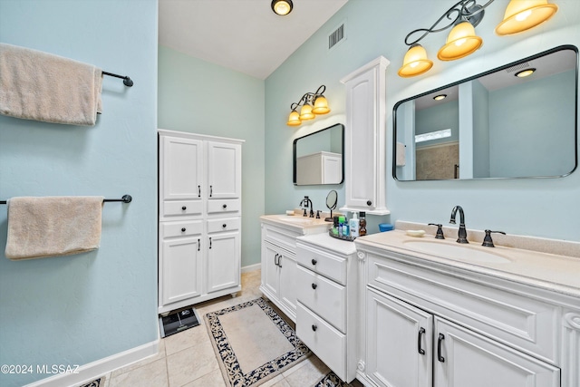 bathroom with tile patterned flooring and vanity