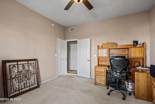 carpeted office with ceiling fan