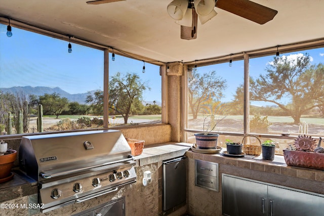 sunroom featuring a mountain view