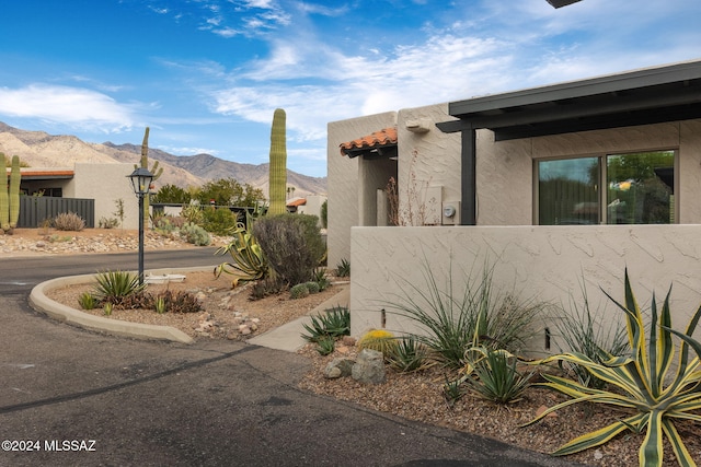 view of side of property with a mountain view