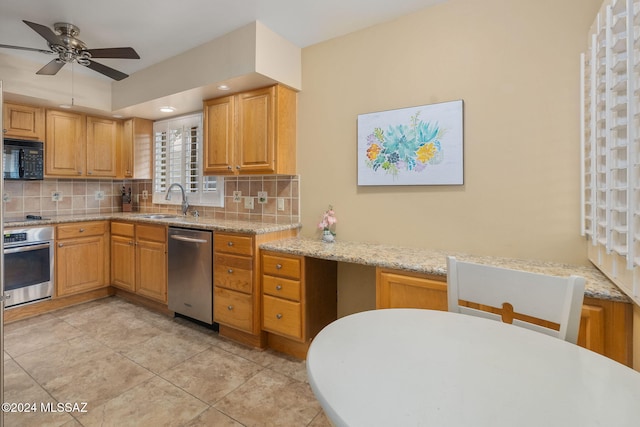 kitchen featuring sink, tasteful backsplash, ceiling fan, and black appliances