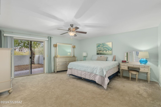 carpeted bedroom with access to outside and ceiling fan