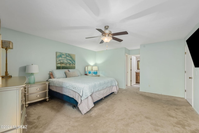 carpeted bedroom featuring ceiling fan and connected bathroom