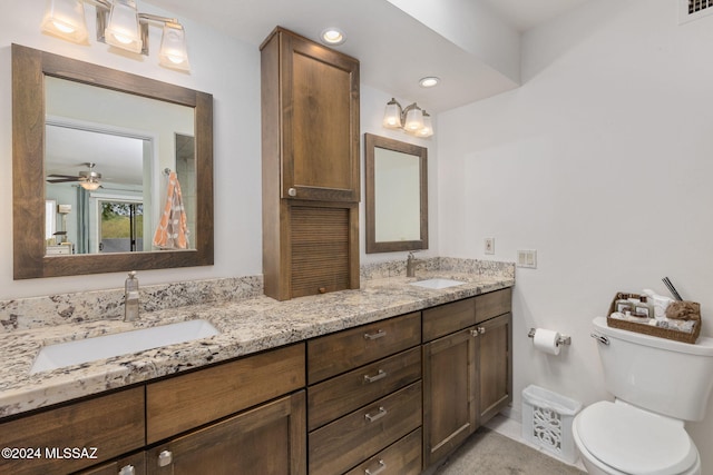 bathroom with ceiling fan, toilet, and vanity