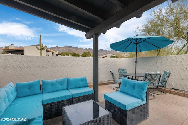 view of patio with a mountain view and outdoor lounge area