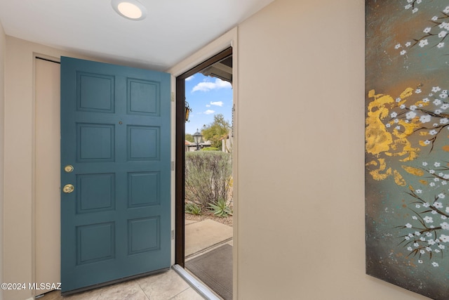 foyer featuring light tile patterned flooring