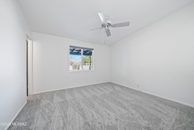 unfurnished room with light colored carpet and ceiling fan