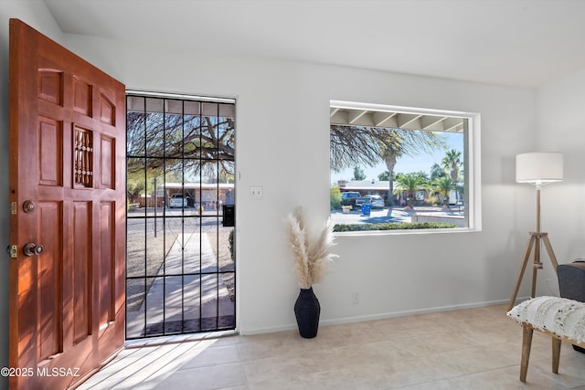 foyer featuring light tile patterned flooring