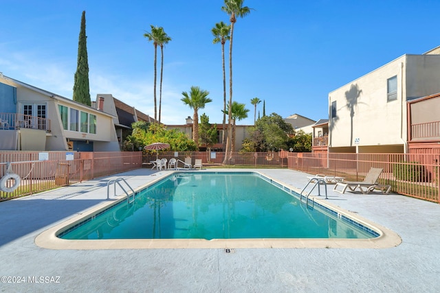 view of swimming pool featuring a patio area