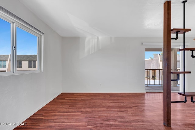 spare room with wood-type flooring