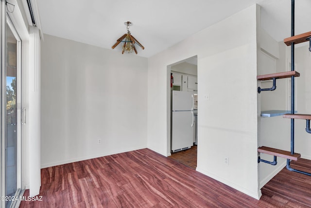 spare room featuring dark hardwood / wood-style flooring