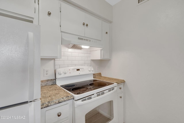 kitchen with white cabinets, white appliances, and tasteful backsplash