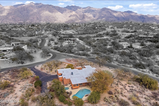 birds eye view of property featuring a mountain view