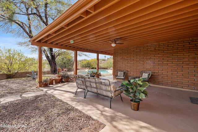 view of patio / terrace with a fenced in pool