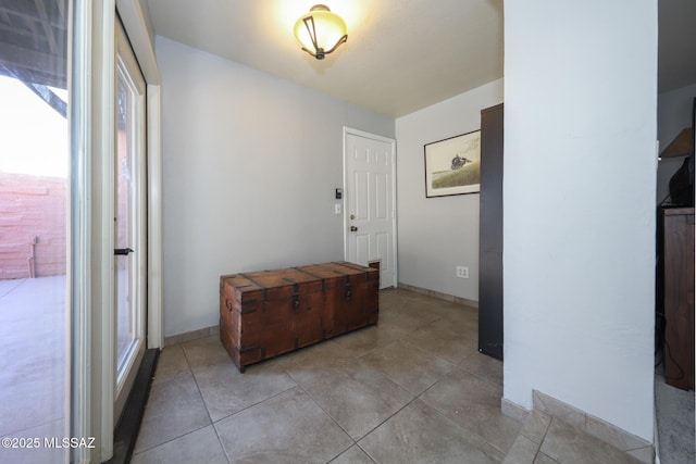 foyer featuring light tile patterned floors