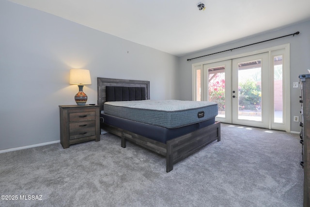 bedroom with access to exterior, french doors, and carpet flooring