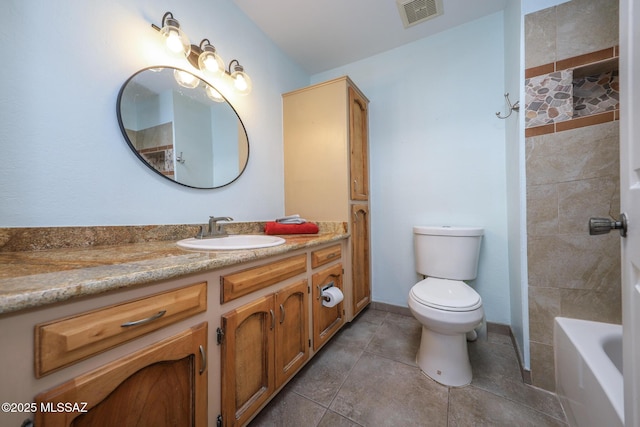 bathroom featuring tile patterned floors, vanity, and toilet