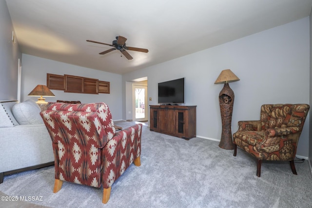 living room featuring light colored carpet and ceiling fan