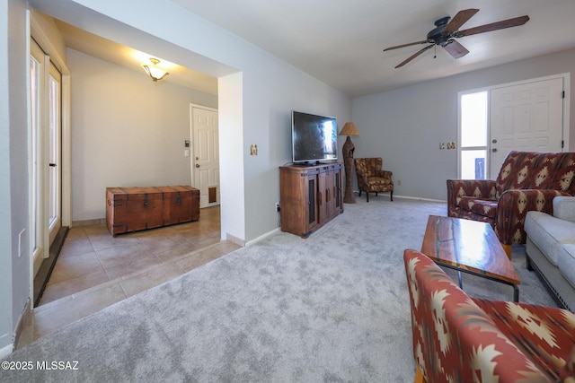 living room featuring light carpet and ceiling fan