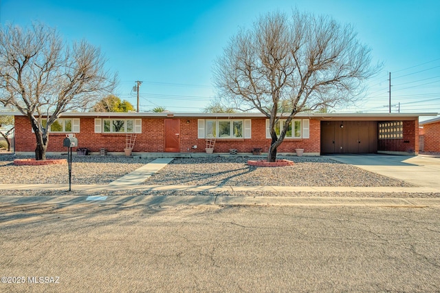 single story home with a carport