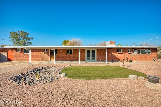 rear view of property with a patio area