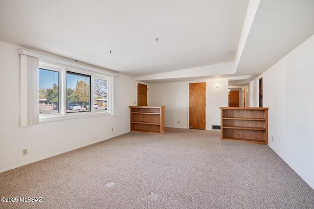 empty room featuring light carpet