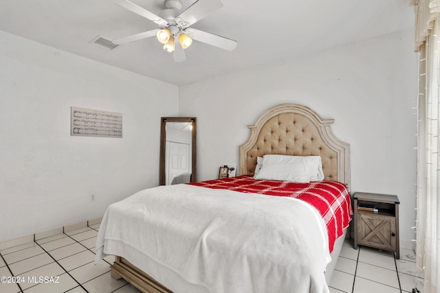 bedroom featuring light tile patterned floors and ceiling fan