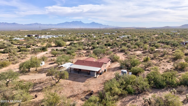 birds eye view of property with a mountain view