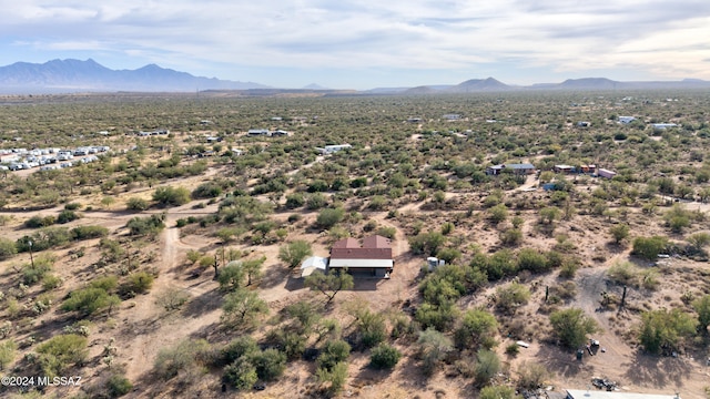 birds eye view of property featuring a mountain view