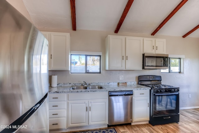 kitchen with white cabinetry, sink, and appliances with stainless steel finishes