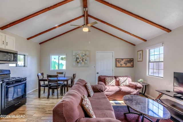 living room with beamed ceiling, high vaulted ceiling, and ceiling fan