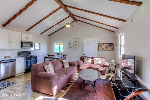 living room with beamed ceiling, high vaulted ceiling, and ceiling fan