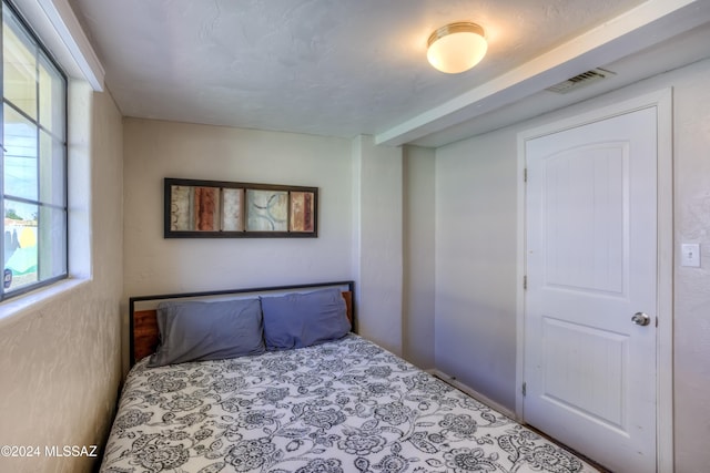 bedroom featuring multiple windows