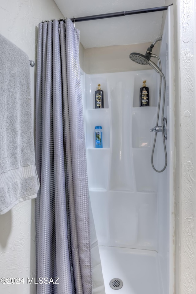 bathroom featuring walk in shower