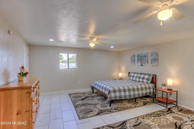 tiled bedroom with ceiling fan