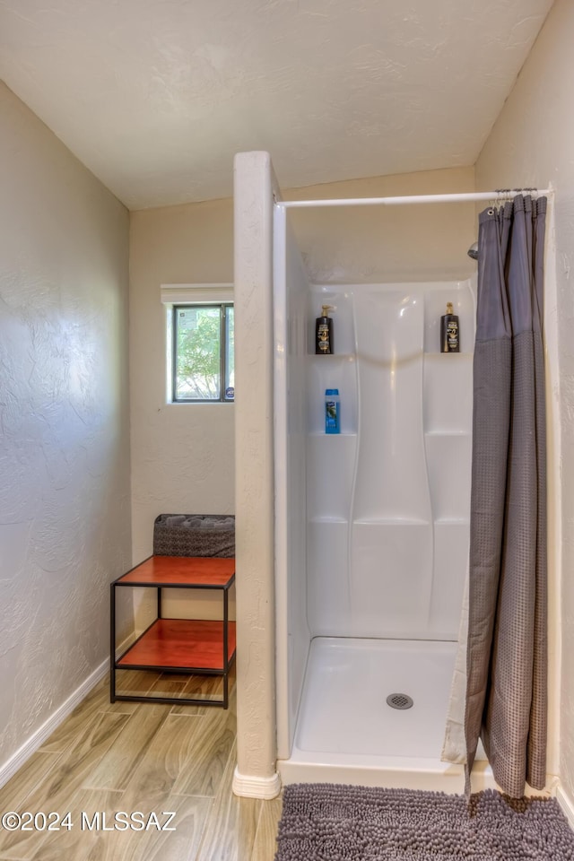 bathroom with a shower with shower curtain