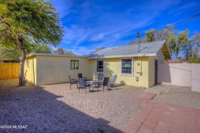 rear view of house with a patio