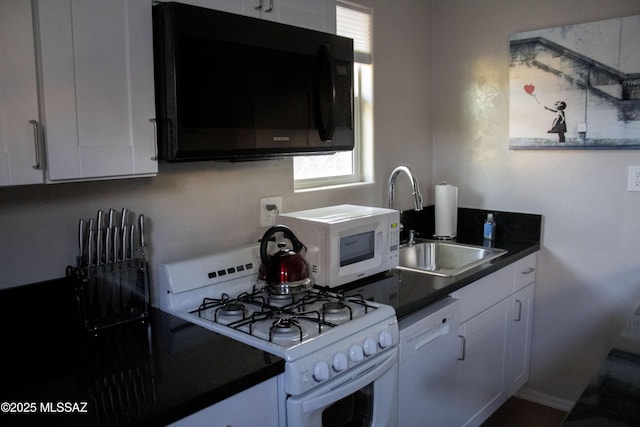 kitchen with white cabinets, white appliances, and sink